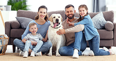 family with pet enjoying the best indoor air quality